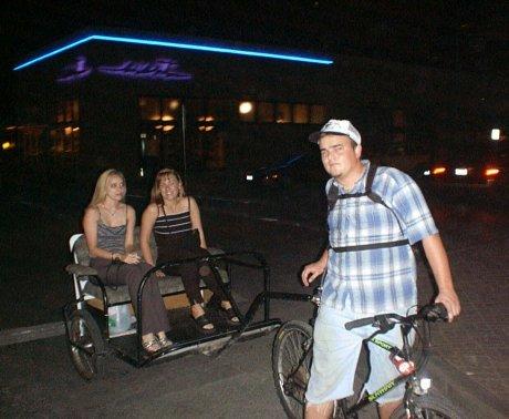 JMB driving a pedicab in Austin, Texas in 2001